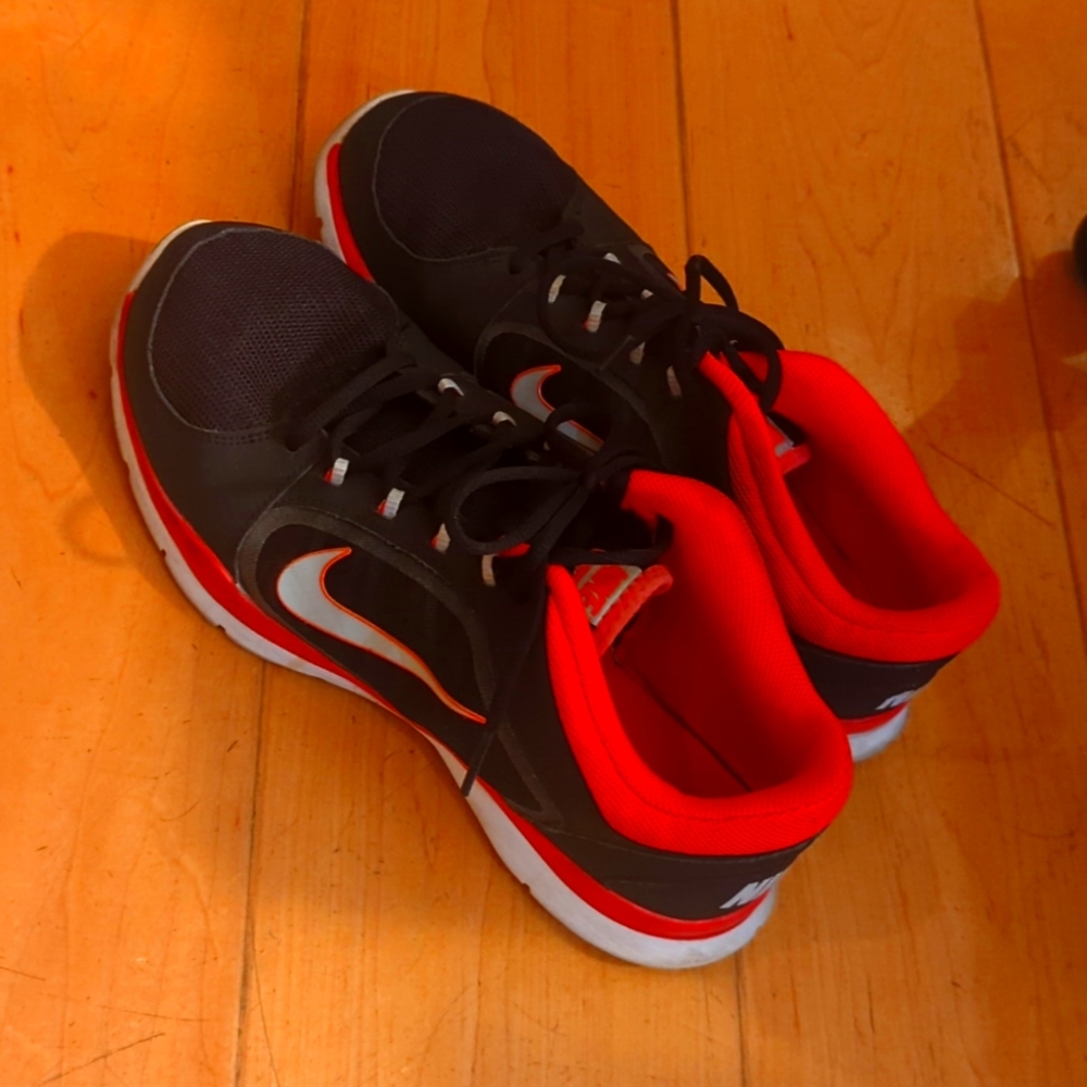 Black and hot pink/coral Nike sneakers